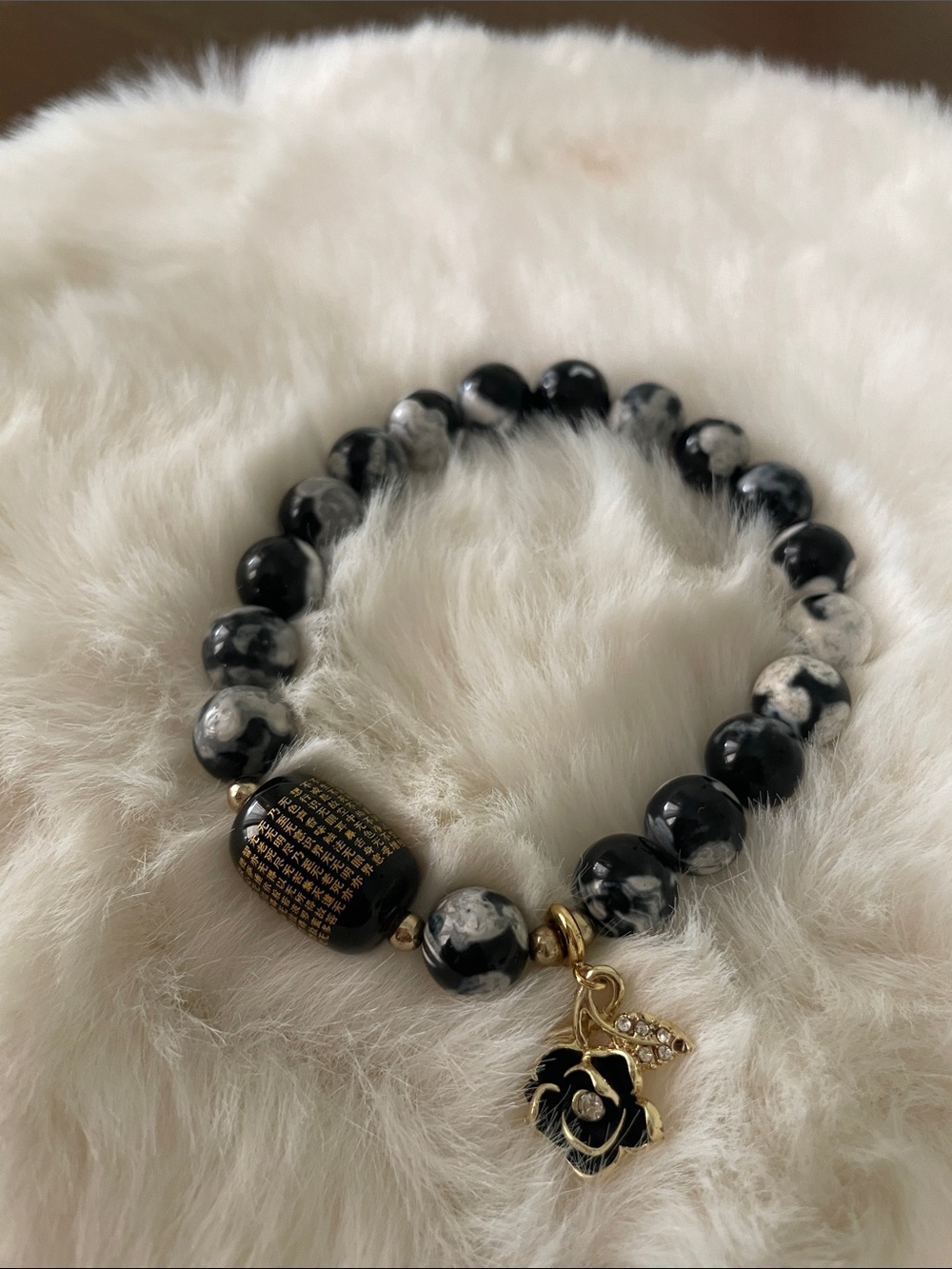 Elegant Black & White Beaded Bracelet with Gold Flower Charm